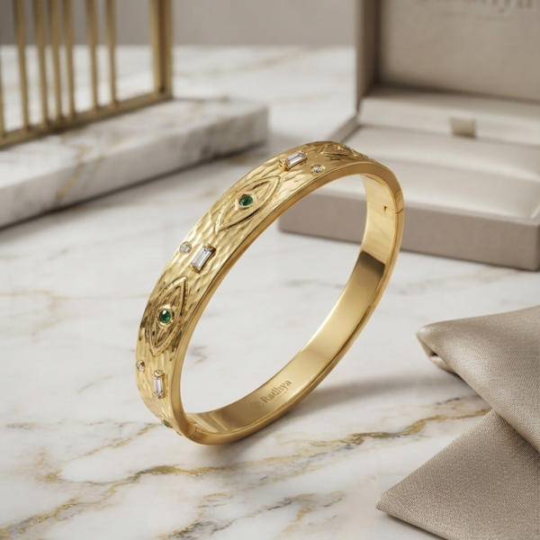 Gold hammered bracelet with evil eye stones