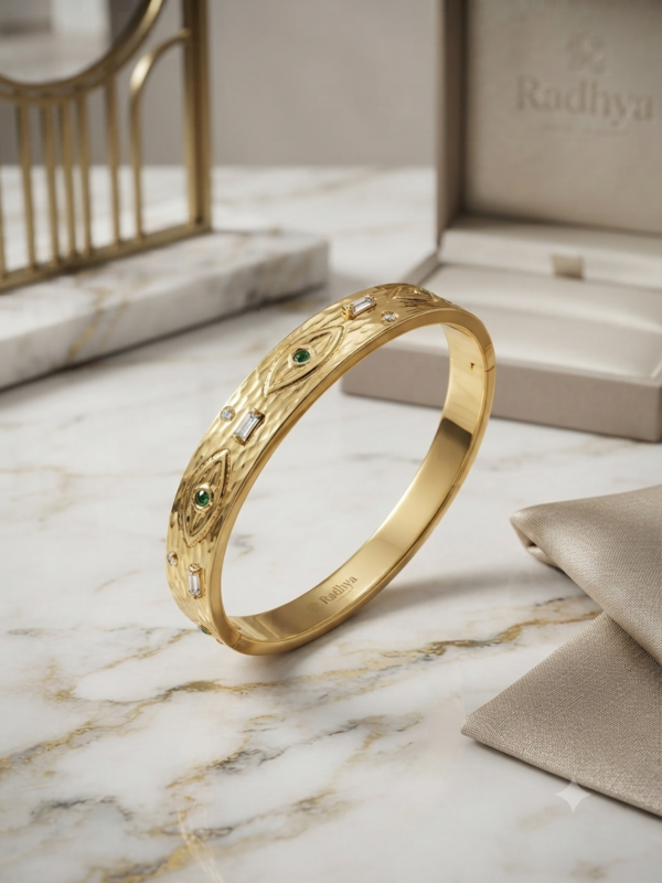 Gold hammered bracelet with evil eye stones
