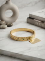Gold hammered bracelet with evil eye stones