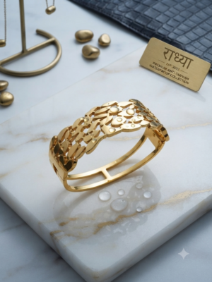 Elegant gold finish cutwork leaf motif bracelet.