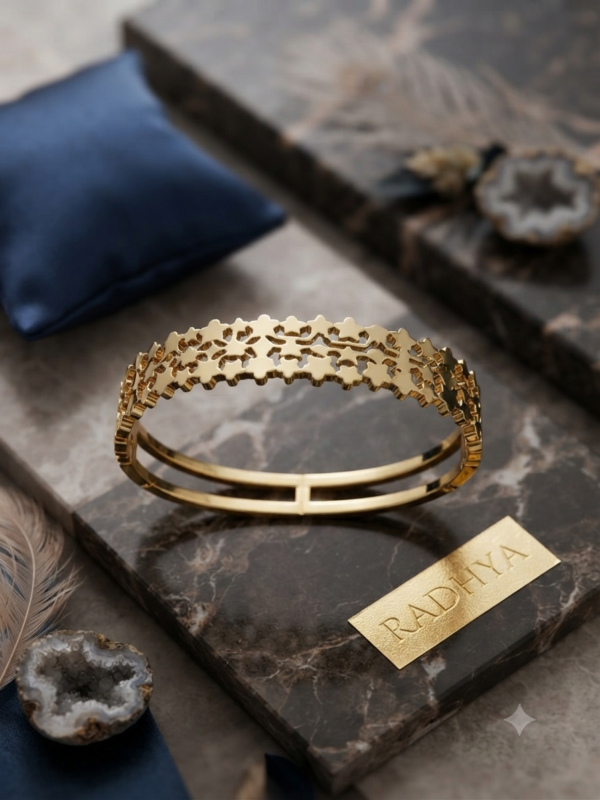 Radiant gold star motif cutwork bracelet