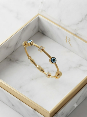 Gold hammered bracelet with evil eye stones