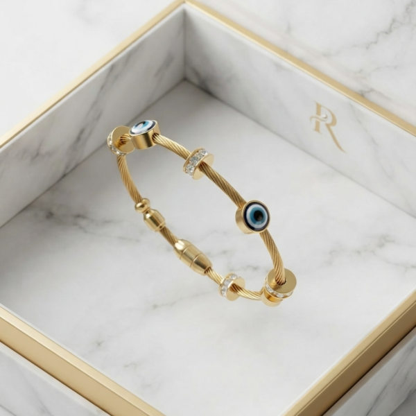 Gold hammered bracelet with evil eye stones