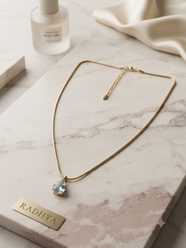Elegant gold chain with teardrop pendant