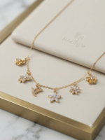 Dainty gold chain with sparkling floral charms