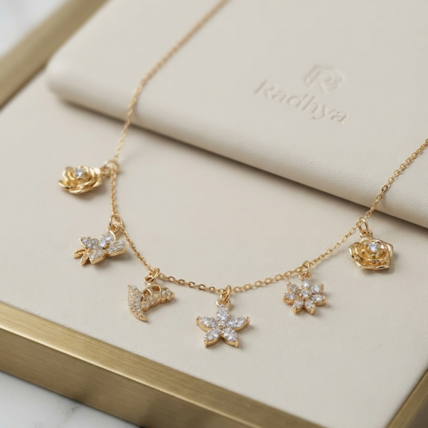 Dainty gold chain with sparkling floral charms