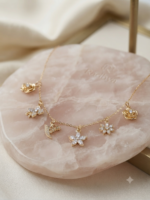 Dainty gold chain with sparkling floral charms