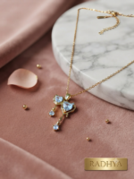 Gold chain with light blue heart pendant