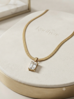 Golden snake chain with emerald-cut pendant