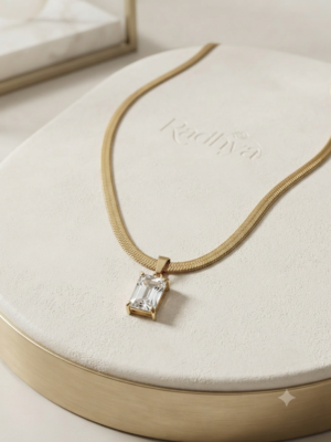 Golden snake chain with emerald-cut pendant