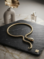 Sleek gold snake chain necklace with detailed head