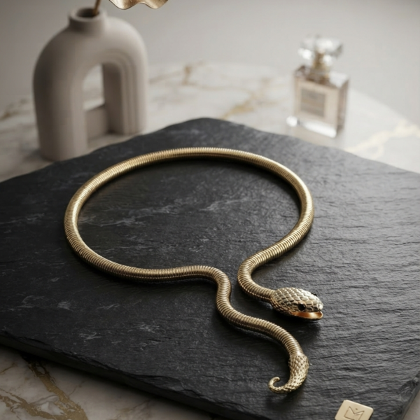 Sleek gold snake chain necklace with detailed head