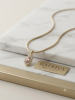 Gold snake chain with pink marquise pendant