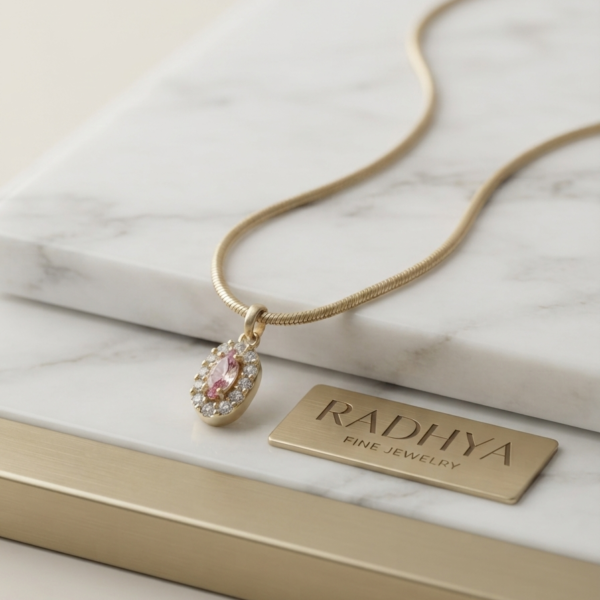 Gold snake chain with pink marquise pendant