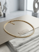 Elegant gold finish AD tennis neckchain.