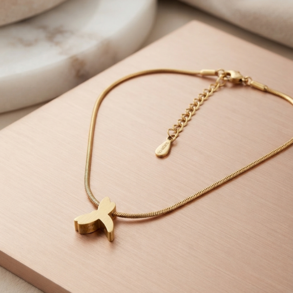 Gold finish snake chain with cute dolphin pendant.