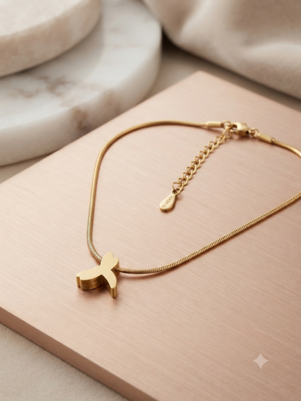 Gold finish snake chain with cute dolphin pendant.