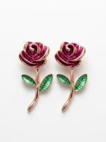 Charming black rose earrings with green leaves.