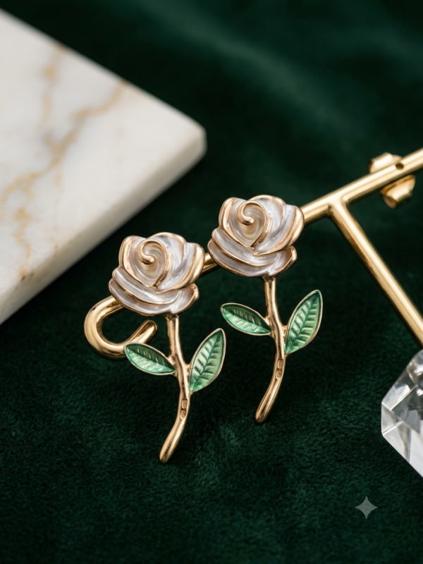 Charming black rose earrings with green leaves.