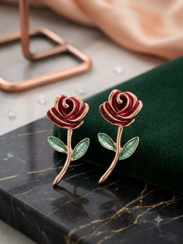 Charming black rose earrings with green leaves.