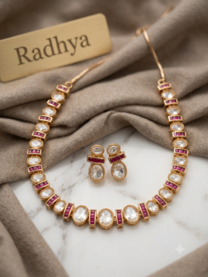 Elegant gold finish ruby and white polki necklace set.