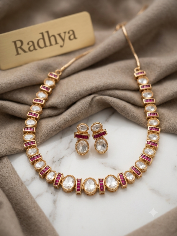Elegant gold finish ruby and white polki necklace set.