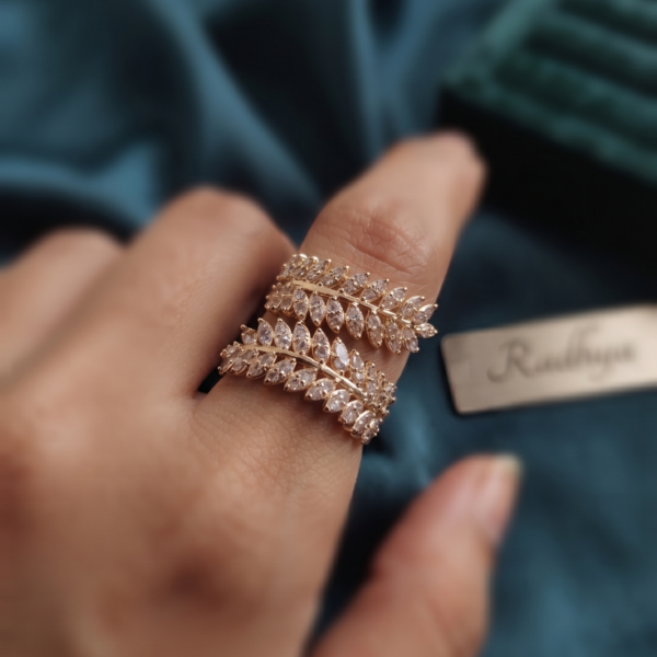 Elegant dual leaf band ring with sparkling AD stones.