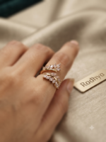 Elegant dual leaf band ring with sparkling AD stones.