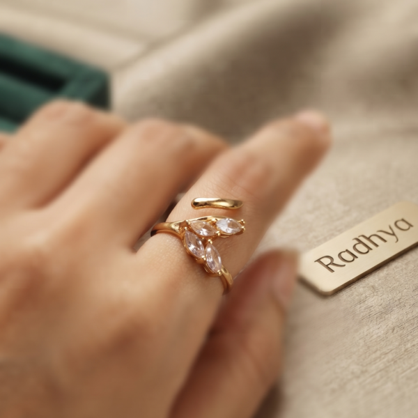 Elegant dual leaf band ring with sparkling AD stones.